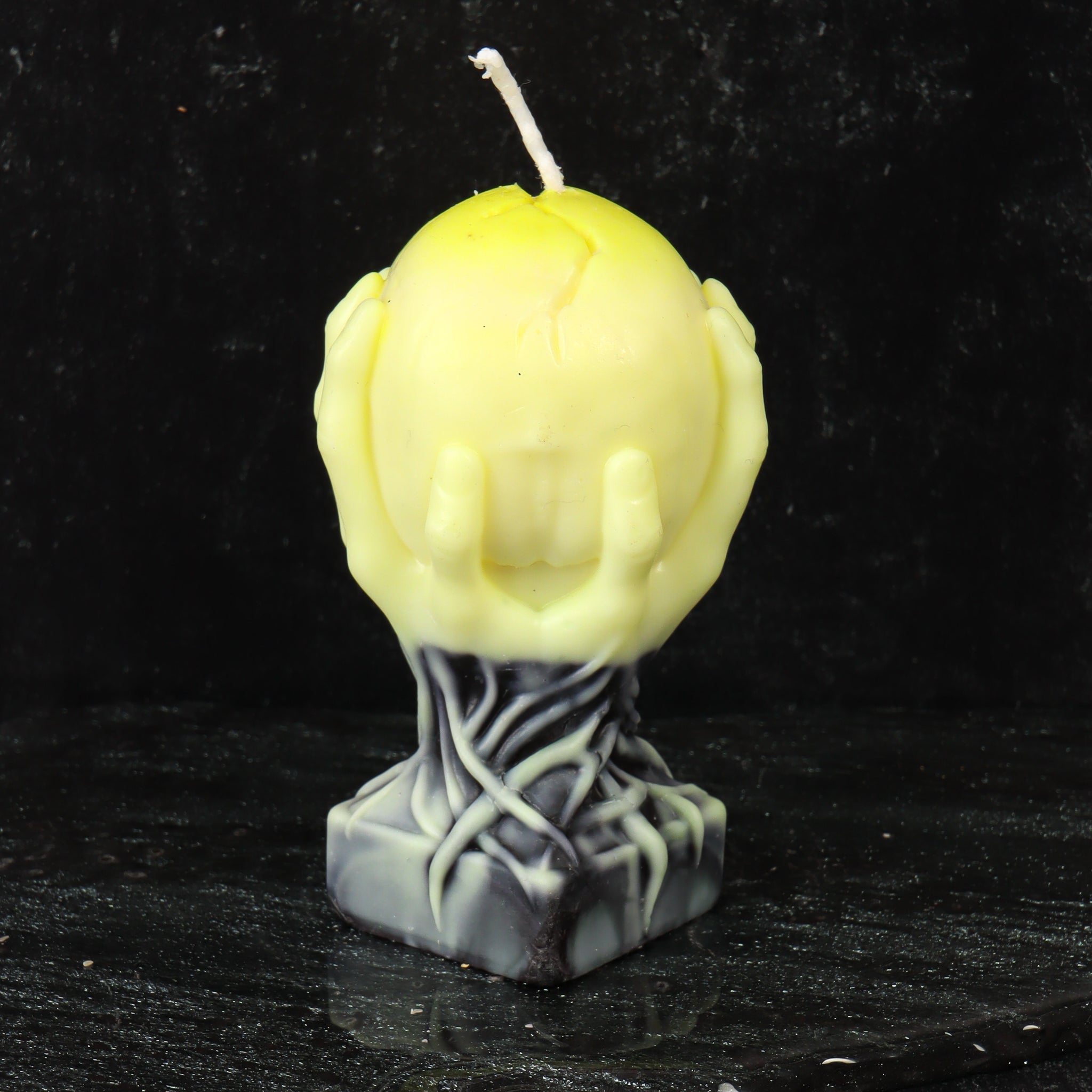 Skull in Hands Candle